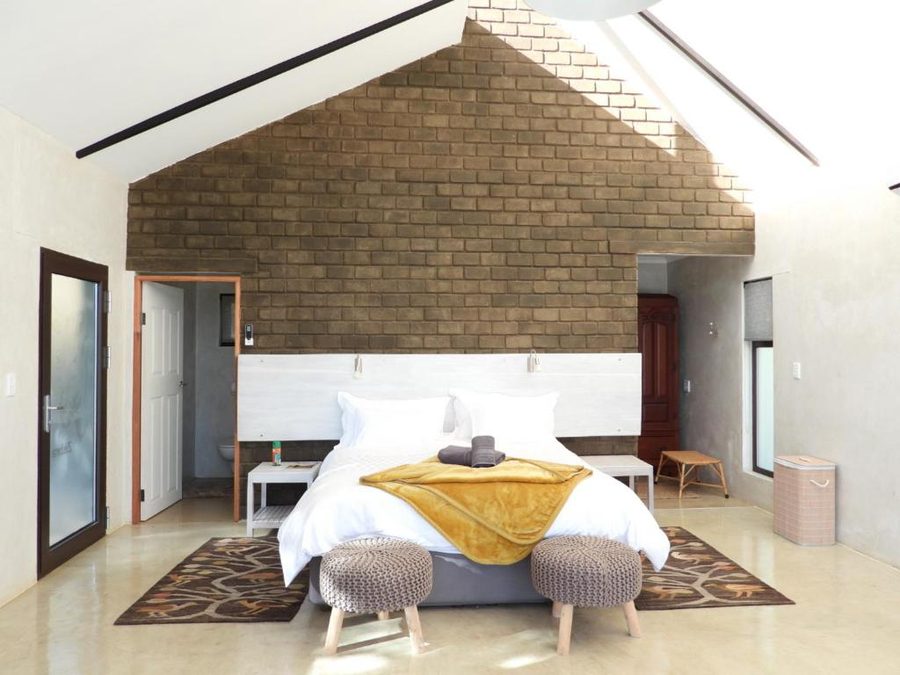 Bright bedroom with a high brick gable