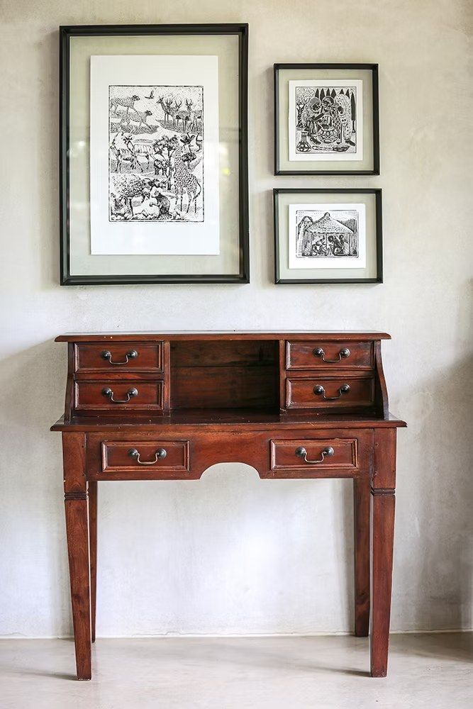 Antique desk and local art in the cottage