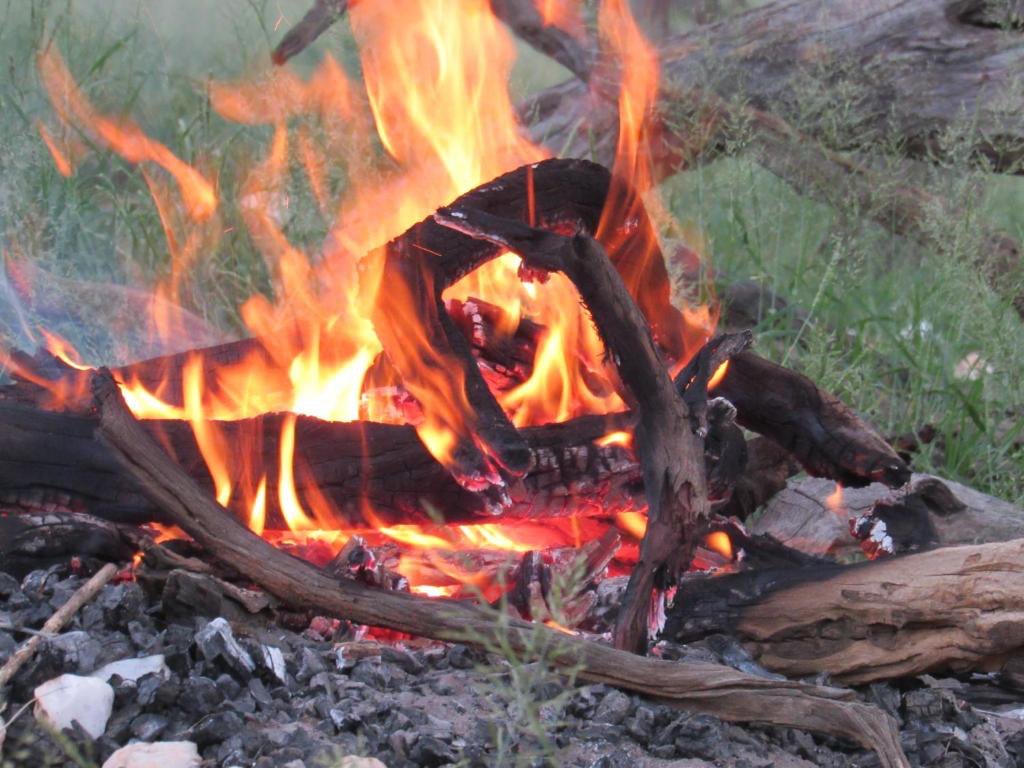 The braai fire glowing in the evening