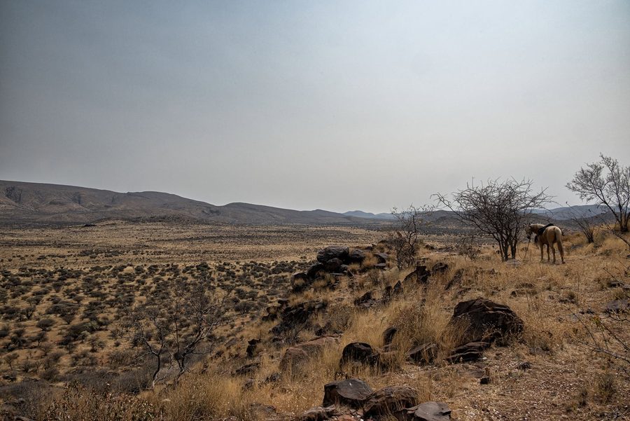 View across the rocky plateau towards the mountains
