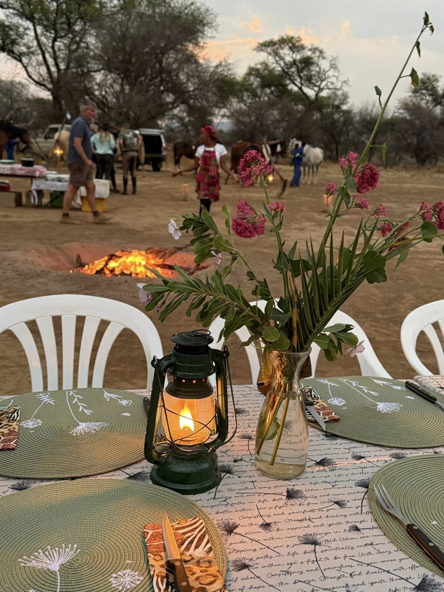Lantern and flowers on the table, the fire burning behind
