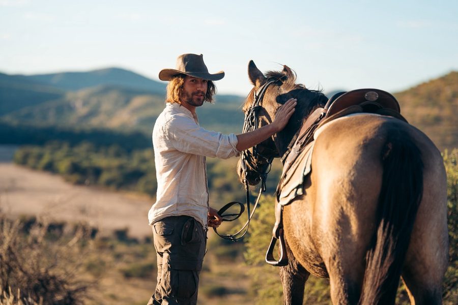 Sándor Miko with a horse in the hills